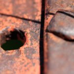 photo of an orange bolt and hole
