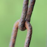close up photo of an old rusty chain