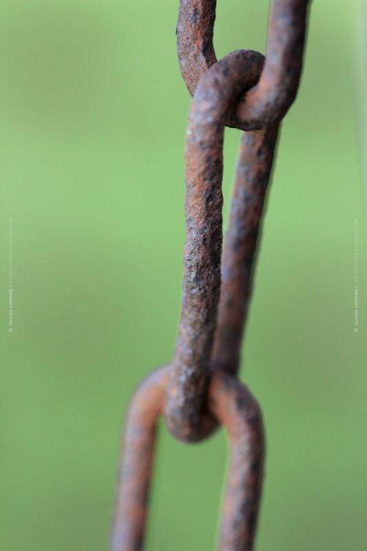 close up photo of an old rusty chain