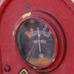 photo of a gauge on an old red McCormick Farmall Tractor